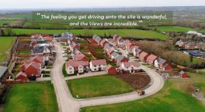 Drone image with positive review reading - The feeling you get driving onto the site is wonderful, and the views are incredible.